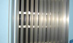 Custom style Vertical Blinds
Aluminum Material with a brushed stainless steel finish
Complete with brackets, tracks and head rail.
The shades each measure 3 1/2" by 51 1/2" are in the curved style. They click into the clips in the track.
Super easy to