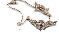 I have a very nice Victorian era Scottish Sterling silver and amethyst thistle choker necklace. It's makers mark SS. Marked sterling silver on back. Weight is 5 grams total. 1-3/4" wide. Serious inquiries call 845-754-7233 CASH OR PAYPAL FREE SHIPPING IN