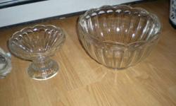 VINTAGE GLASS 2 PIECE GLASS PUNCH BOWL SET WITH 12 CUPS, GLASS LADLE. PEDESTAL AND PLASTIC HOOKS TO HANG CUPS ON BOWL. EXCELLENT CONDITION Measurements are as follows: 13 1/2 inches high, circumference is 38 inches.