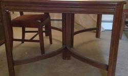 Dinning table is 58x40. This table is in pretty good condition considering its 90+ years old. I don't know much about wood so I'm not sure if its cherry or mahogany wood. I can figure out a frieght price for shipping if needed. I do not have the chairs.