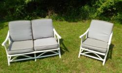 This is a very nice vintage bamboo/rattan loveseat or settee and a matching chair that has been painted a beautiful ivory white color and comes with newer cushions. The loveseat is about 46 1/2" wide from arm to arm, 31" deep and 30" tall. The seat is
