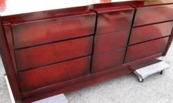 This is an absolutely stunning piece. Must see in person. Clean-lines, mid century modern aesthetic featuring bold, broad-beveled framing. Made by Tri-Bond Furniture in 1958. The mahogany has a deep red color. In excellent condition and extremely well
