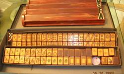 Highly prized and sort after Bakelite/Catalin Enrobed set ca. 1950's was my mom's. There are no markings on the case but I believe it was made by Met Games based on the tiles. Set is complete for American play 158 tiles in total and all original to the