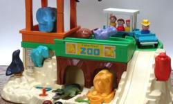 Selling a vintage Fisher Price Zoo, circa 1984, complete with train, people and picnic set. Number $916, beautiful pre-owned condition. It's about 12 inches high, 18 inches wide and 15 inches deep. Includes all the little food trays, toucans, parrots,