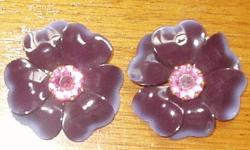 Vintage enamel fur clips. Deep purple with rhinestone in center. Spots on petals are from camera flash.