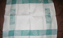 Most of the linens shown are from the 1940s and 1950s and sell for $10 or less.
The first picture shows one of two identical cotton napkins that sell for $10 for the pair.
The second picture shows one of the many doilies that are available.
The third