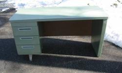 This vintage tanker desk is likely from the 1960s. Great condition for its age. Green with a pale green top. This single pedestal desk is much smaller than your typical tanker desk. The width measures 55", but its only 24" deep. The return adds more work
