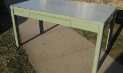 This steel four leg table is not only a conversation piece due to its history, clean lines, and finish, but it is also highly functional in any setting: office, dining room, kitchen, etc... A must see. You won't find many of these on Craigslist,