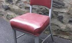 I have several vintage steel office/side chairs to choose from. This one has the original red vinyl seat covering. I also have a similar one in a mustard yellow and in green. They're very sturdy and in good condition for their age. These chairs are
