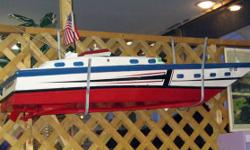 This an undated Remote Control RC Motor Speed Boat. It is in very good condition and is offered "as-is". This comes with the original motor and installed servo's. We are not RC experts and will probably not be able to answer any questions beyond what is