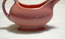 vintage rose-colored Fiesta gravy boat in perfect condition, approximately 7 7/8" wide, 4 7/8" high and 4.3" wide