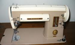 Highly desirable vintage Singer Sewing Machine Model 301A in Wood Cabinet with Attachments/Feet. Excellent working order.
They don't make 'em like they used too!
1950s Vintage Model Singer 301A in a handsome wood cabinet with 3 drawers and LOTS of