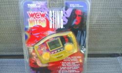 Tiger Electronics Model 74-092, WCW Nitro Sting
Electronic hand held game
Let's get ready to rumble in WCW Monday Nitro!
Exciting WCW/NWO wrestling game starring Sting!
10 moves including the Scorpion Death Drop!
7 levels of hard hitting, off the ropes