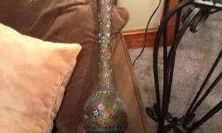 This item is a vintage vase which stands 15 1/2 inches tall and the
opening is 2 1/2 inches wide. This item features inlaid beads/stones
there is a small dent on the back side of the vase. The vase is also
numbered 15.
If you like different things you