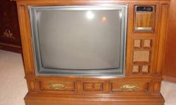 This is an Amazing wood console TV in excellent working condition.
It has a cable operated remote control (original remote control does not work if cable is connected)
Width: 39"
Height:32"
Depth:19
