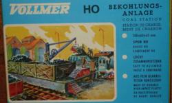 USA SHIPS FREE!
For sale are two (2) HO Scale TRACKSIDE ACCESSORIES from Vollmer.
You will receive:
* 1 - Kit #5719 B - Coal Station (Bunker)
Dimensions: 5-5/8 x 2-1/2" (13 x 6 x 6.5cm)
* 1 - Kit #5705 - Loading Gauge and Water Spout/Column
Column: 2-1/2