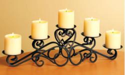 heavy iron- antiqued gold candelabra,,set of 2 comes with 10 glass globes and ten mulberry colored candles.