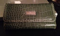 Wallet Organizer Faux Snakeskin grey green $10 minicci brand looks like it is a Payless shoe source item. Brand New. With tags. 2 Zipper pockets. Places for credit cards ID cards and photos. Cash only. Pick up only. Midtown West.
This ad was posted with
