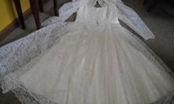 WEDDING DRESS -- Gorgeous!! white satin with exquisite lace over entire dress! Size 18. Excellent condition! Applique on front has high quality sequins and pearls. 50% polyester and 50% cotton, "made in USA", "tea length", to just above the ankles. Smoke