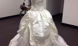 Brand new Strapless Princess style Wedding gown never worn paid $4500 willing to negotiate price.