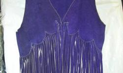 What was old is now new, back in fashion are the fringed western style suede vast. This is a deep purple unfortunately I can't capture the true color in the photo. There is not maker label but appears to be hand made by a village shop. It has wonderful