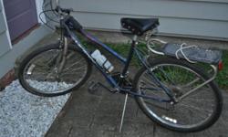26"Huffy woman's mountain bike. with caddy rack. Works great and is in very good shape since its been stored in our garage. $50 located in unadilla ny 13849