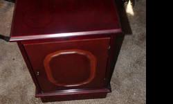 Wood end table. Mahogany (or cherry?) finish. 21"H 23" Deep 14" Wide $45 OBO
Full door w/pull out shelf.
Decent condition but has scratches inside and out.