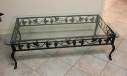 Wrought Iron Coffee Table (black and green distressed look) with glass top.
Please call for more information
315-769-3738
