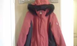 This red and black ZeroXposur coat features silver hardware and a faux fur-lined detachable hood. Coat has interior and exterior pockets; exterior pockets have zipper closure. Coat has a full zipper with snap overlay closure and interior hip snap closure