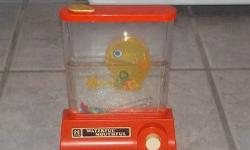 1976 Tomy Waterful Mouthful- Classic 1970's Toy!
Poor Condition- Plastic has cracks, scratches, marks, dust and dirt marks. There is also cracks on the inside.
The toy does not leak. I tested it.
It still has the water from the original owner.
I purchased
