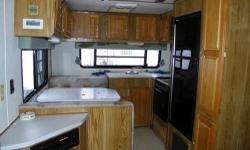 Here is a camper for a DIY guy or handy-man. The ceiling has a hole in it and is leaking. This is a rough camper that needs the right person to give it some TLC. You can't go anywhere else and get a big fifth wheel camper for $1,500!! To strip the camper