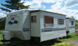 PRICE REDUCED!! Tow behind camper trailer for sale. 33' - 2001 Titan Sunnybrook trailer with 2 slide outs, sleeps 6. It is fully stocked with furnace, 10 gal hot water heater, stove & oven, microwave, 8 cu ft. refrigerator/freezer, air conditioning, small