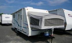 Wow this is a nice hybrid camper!!! Its super light and spacious. Inside, you'll find two bed popouts as well as a bed on the side. It has a nice size fridge with everything in the kitchen you need, and a nice big table with lots of room. Why buy a big