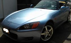 2002 Honda S2000 with 43,500 miles. Six speed manual transmission with a power top convertible. Exterior color is Suzuka blue metallic with a dark blue interior. Clean title with no accidents. Vehicle is in great condition and has never been modified.