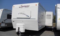 You can save big $$$ by buying an older model camper. This is a 2002 Keystone Sprinter and its super clean inside. There is a nice super slide-out on this camper that opens it right up with a beautiful picture window in the back. There is a separate