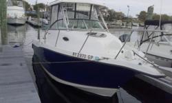 Re-powered by Twin 2014 Suzuki 150 hp 4 Stroke EFI's (6 Yr warranty). Beautiful Navy and White hull. Excellent condition thru-out. Huge cockpit, Sleeps 2, Stand up head, Stove, Sink, Am/Fm/Cd, VHF, Windlass, Garmin 550 GPS. No trailer, but locally