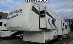 WOW This camper is HUGE inside!! It has four slides in total; two on either side of the living room, one on the kitchenette, and one in the bedroom. This camper is bigger than my first apartment!! The kitchenette is big and beautiful, and has tons of