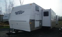 This is a very nice camper that would be great for a permanent site!! It is 38ft with two slides, four bunks, and weighs about 8,300 lbs. Inside you'll find a nice kitchen area with stove, oven, microwave, full size fridge, and tons of space!! If you