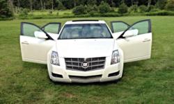 Pearl white Cadillac CTS 2008. Please serious inquiries only. This vehicle is at a lower then usual price because it has a salvage title. Cadillac has BOSE sound system, moon roof, tan leather interior, OnStar option, RWD and sport mode option. The