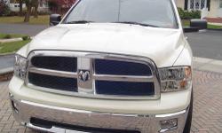 This is a beautiful White Ram 1500 Bighorn Edition. This truck is nicely equipped with a 5.7L HEMI engine, 5-speed 4x4 automatic transmission, 20" factory chrome clad wheels, power windows, locks, mirrors and driver's seat, CD player with Sirius Satellite