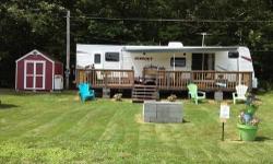 This travel trailer is in immaculate condition...looks and smells brand new. Currently is set up at Belden Hill Campground which is 15 minutes from Binghamton (Can be moved from campground). Perfect for quick weekend getaways. Comes complete with deck,