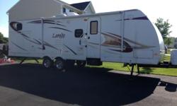 2010 Loredo 30 ft.Travel Trailer for sale. Sleeps 7-8. Bunk house in the rear, Master up front. Full bathroom, outdoor kitchen, Microwave, oven , double sink, flat screen TV with DVD player and surround sound and outdoor speakers. Gently used! Very good