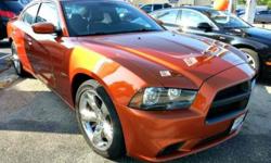 This aggressive Dodge Charger is a V8 powerhouse that is loaded with option, and could be the one you've been dreaming of! This very rare muscle car is gorgeous in Orange Pearl, and loaded up with Navigation and chrome wheels! Additional options on this
