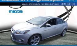 $2962 below NADA Retail* How awesome is this fun 2013 Ford Focus Titanium** Ready for anything!!! Less than 7k Miles.. Great safety equipment to protect you on the road: ABS Traction control Curtain airbags Passenger Airbag Front fog/driving