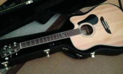 This guitar is in excellent condition and cared for. No dents/nicks/scratches etc. Plays exceptionally well for price. Recently added new Elixir nanoweb light strings. Included hardshell case and strap. This is the acoustic electric model version of the