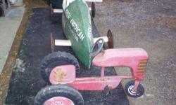 Kids antique ride-on tractor....great restoration project. 2 Wheels in back 1 in front not sure of the age but we know it is over 50 yrs old. $75 OBO