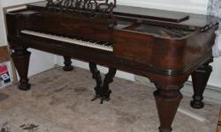 Square grand piano manufactured by Hallet and Davis, Boston, Massachusetts in 1854; serial number 11399. Needs some restoration. Inside looks great; no evidence of mice, etc. Previous owner had it in her house and it has been well taken care of but