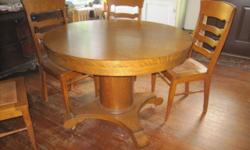 Blow out SALE! This Table is in unbelievably great condition! Not a scratch on it! I also bought a round thick piece of glass to use over the top of the table that is not pictured here that is included in the purchase. There are five chairs! 3 leaves come