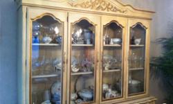 Beautiful Country French Mid Century China Cabinet.
Excellent condition. Fine carved details.Unique piece of furniture.
Designer's own. Must sell, moving.
Easy to transport, two pieces.
72" W x 82" H x 19" D
Cabinet has interior lights and two glass