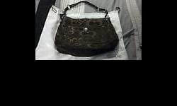 I have a brown coach purse for sale its in great condition. it has a zipper pocket on the inside with coach tag with serial # on it. Also 2 more pockets. On the outside has a huge pocket on the front. The purse closes with a clasp. The bottom of purse is